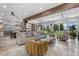 Spacious living room with tile floors, comfortable seating, and views of the backyard and lake at 13120 Zori Ln, Windermere, FL 34786