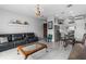Open-concept living room and dining area with hardwood floors and modern furniture at 13120 Zori Ln, Windermere, FL 34786