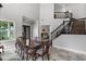 Dining area with tall ceilings and an open staircase at 13120 Zori Ln, Windermere, FL 34786