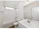 Well-lit bathroom with a shower/tub and a large mirror at 13123 Faro Ct # 23, Winter Garden, FL 34787