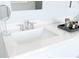 Close up of a white bathroom sink and faucet with vanity accessories at 13123 Faro Ct # 23, Winter Garden, FL 34787