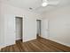 Spacious bedroom with a large closet and hard wood floors at 13123 Faro Ct # 23, Winter Garden, FL 34787