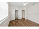 Bedroom with a closet, a window, and wood floors at 13123 Faro Ct # 23, Winter Garden, FL 34787