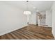 Dining room featuring wood floors, access to stairs and is adjacent to kitchen at 13123 Faro Ct # 23, Winter Garden, FL 34787