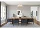 Elegant dining room featuring a large wooden table, comfortable seating, and stylish decor at 13123 Faro Ct # 23, Winter Garden, FL 34787