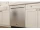 Stainless steel dishwasher installed in white cabinetry with modern hardware at 13123 Faro Ct # 23, Winter Garden, FL 34787