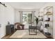 Bright home office with a cozy reading nook, modern desk, and ample storage shelves at 13123 Faro Ct # 23, Winter Garden, FL 34787