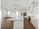 Modern kitchen with a large island, stainless steel appliances, white cabinets, and an open floor plan at 13123 Faro Ct # 23, Winter Garden, FL 34787