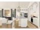 Stylish kitchen with a large island, white cabinetry, and views into the living space at 13123 Faro Ct # 23, Winter Garden, FL 34787