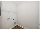 Utility room features wood-look floors, storage shelf, and washer and dryer hookups at 13123 Faro Ct # 23, Winter Garden, FL 34787