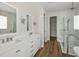 Luxurious main bathroom with double vanities, a glass enclosed shower and separate walk in closet at 13123 Faro Ct # 23, Winter Garden, FL 34787