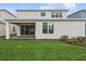Expansive backyard features a covered patio, lush green lawn, and well-manicured landscaping at 13181 Telsen St # 39, Winter Garden, FL 34787