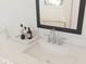Bright bathroom featuring a white countertop, a modern sink, and stylish fixtures at 13181 Telsen St # 39, Winter Garden, FL 34787