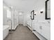 Luxurious bathroom featuring a soaking tub, glass shower, and double vanity sinks at 13181 Telsen St # 39, Winter Garden, FL 34787