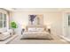 Bright bedroom with a cozy bed, large windows, and stylish decor at 13181 Telsen St # 39, Winter Garden, FL 34787