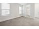 Bright bedroom with tile flooring, a double window, and an ensuite bathroom with a glass shower enclosure at 13181 Telsen St # 39, Winter Garden, FL 34787