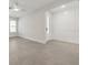 Bright bedroom with tile floors, recessed lighting, fan, large windows, and a door leading outside at 13181 Telsen St # 39, Winter Garden, FL 34787