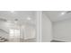 Hallway with tile flooring, recessed lighting, and a view of the adjacent rooms and stairway at 13181 Telsen St # 39, Winter Garden, FL 34787