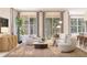 Inviting living room with large windows, comfortable seating, and stylish decor, perfect for relaxation at 13181 Telsen St # 39, Winter Garden, FL 34787