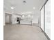 Open concept living area with tile flooring, recessed lighting, and a kitchen with stainless steel appliances at 13181 Telsen St # 39, Winter Garden, FL 34787