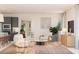Open-concept living space featuring stylish seating, modern decor, and abundant natural light at 13181 Telsen St # 39, Winter Garden, FL 34787