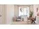 Bright office space with a stylish gray chair, desk, artwork and snake plant at 13181 Telsen St # 39, Winter Garden, FL 34787