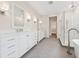 Bright bathroom features dual vanities, a soaking tub, and a separate glass-enclosed shower at 13187 Telsen St # 38, Winter Garden, FL 34787