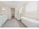 Modern bathroom features a soaking tub, glass shower and dual sink vanity at 13187 Telsen St # 38, Winter Garden, FL 34787