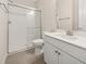 Bathroom featuring a sleek glass-enclosed shower and a modern single sink vanity at 13187 Telsen St # 38, Winter Garden, FL 34787