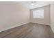 Bedroom boasts laminate flooring, neutral walls and large window at 13187 Telsen St # 38, Winter Garden, FL 34787