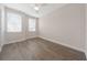 The light-filled bedroom boasts laminate flooring, bright windows, and modern ceiling fan at 13187 Telsen St # 38, Winter Garden, FL 34787