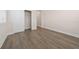 Minimalist bedroom with wood flooring, white trim, a closet, and a window to let in natural light at 13187 Telsen St # 38, Winter Garden, FL 34787