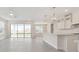 Open-concept living space featuring tile floors, a ceiling fan, recessed lighting, and a sliding glass door to the backyard at 13187 Telsen St # 38, Winter Garden, FL 34787