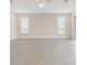 Large living area with tile flooring, recessed lighting, and natural light through windows at 13187 Telsen St # 38, Winter Garden, FL 34787