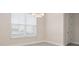Room with a window with blinds, neutral walls, and a door to the side at 13187 Telsen St # 38, Winter Garden, FL 34787