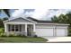 Beautiful single-Gathering home with a large two-car garage and well-manicured lawn at 1335 Wood Line Dr, Deland, FL 32720