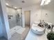 Bright bathroom with double sinks, a glass shower, and contemporary fixtures at 14533 Crestavista Ave, Clermont, FL 34714
