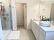 Beautiful bathroom with double sinks, glass shower, and plenty of counter space at 14533 Crestavista Ave, Clermont, FL 34714