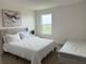 Bedroom featuring a full and twin bed and bright natural light at 14533 Crestavista Ave, Clermont, FL 34714