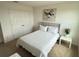 Comfortable bedroom featuring an abstract print and closet with double doors at 14533 Crestavista Ave, Clermont, FL 34714