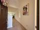 Bright foyer features a wood floor, high ceilings and an art piece at 14533 Crestavista Ave, Clermont, FL 34714