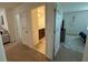 Upstairs hallway with views into a bathroom and bedroom at 14533 Crestavista Ave, Clermont, FL 34714