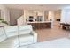 Open-concept kitchen featuring modern cabinetry, stainless steel appliances, and a large kitchen island with seating at 14533 Crestavista Ave, Clermont, FL 34714