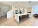 Modern kitchen with an island, stainless steel appliances, and ample counter space at 14533 Crestavista Ave, Clermont, FL 34714