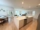 Spacious kitchen with a large island, modern appliances, and an open layout to the living room at 14533 Crestavista Ave, Clermont, FL 34714