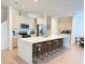 Modern kitchen with a large center island, stainless steel appliances, and sleek cabinetry at 14533 Crestavista Ave, Clermont, FL 34714