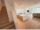 Open concept living area boasts wood floors, large windows and a modern kitchen at 14533 Crestavista Ave, Clermont, FL 34714