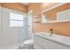 Modern bathroom with a glass-enclosed shower, floating vanity, and stylish fixtures at 187 Tall Pines Pass, Kissimmee, FL 34759