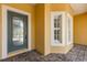 Inviting entryway with a decorative glass door and elegant white trim around the window at 187 Tall Pines Pass, Kissimmee, FL 34759