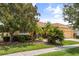 Attractive home featuring mature trees, well-kept landscaping, and a cozy facade at 187 Tall Pines Pass, Kissimmee, FL 34759